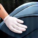 A hand in a nitrile glove wiping a spotless surface for a final check.